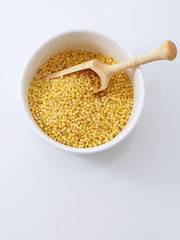Dried raw millet on the white background