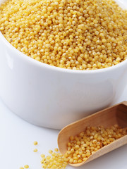 Dried raw millet on the white background