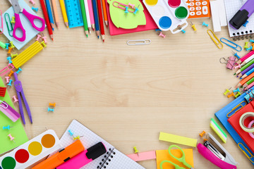 School supplies on brown wooden table