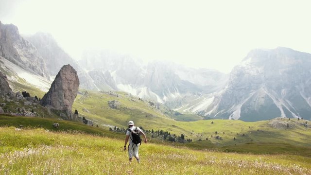 Walking in the beautiful green valley of Seceda with amazing mountain sceneries. The seceda rock.
