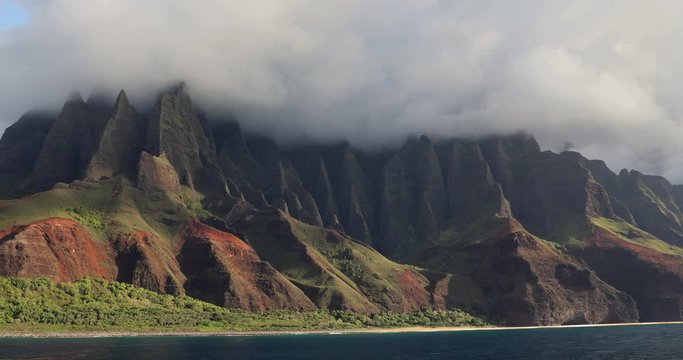 Hawaii beach, Kauai. Na pali coast view from water. Famous Hawaiian travel destination. Napali coastline in Kaui, Hawaii, USA, the Honopu arch.