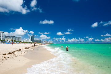 Bright scenic view of the shore of South Beach with vibrant turquoise waves in Miami, Florida, USA