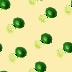 Seamless pattern of Juicy green lime and haft citrus isolated on yellow background. Healthy food concept