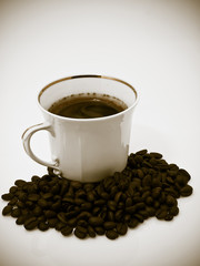 Tasty cup of coffe with bean coffe