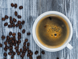 Tasty cup of coffe with bean coffe