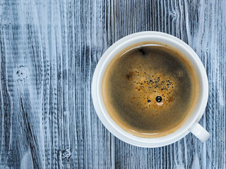 Tasty cup of coffe with bean coffe