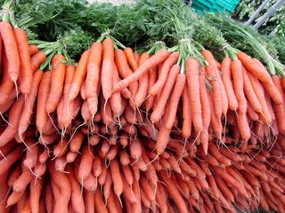Pile of fresh ripe carrots on farmer market