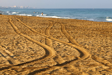 footprints in the sand on the shores of the Mediterranean Sea in the north of Israel