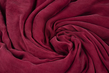 Fototapeta na wymiar Soft smooth burgundy silk fabric background. Fabric texture.