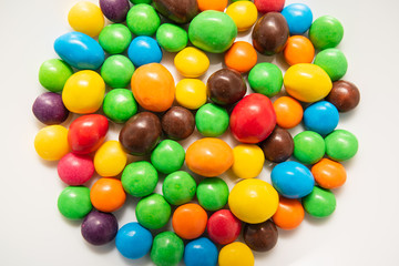 multicolored candies on a white plate