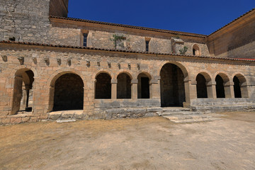 Cloister, arches and columns of a Romanesque church in Tamajón, Guadalajara (Spain)