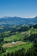 Fototapeta na wymiar Scenic view on single house in the Alps mountains, Switzerland