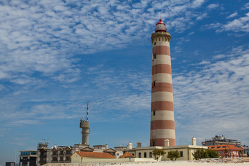 Fototapeta na wymiar The Lighthouse of Praia da Barra, also known as the Aveiro Lighthouse - Portugal.