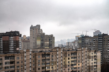 Fototapeta na wymiar City jungle. Photo of a city with tall buildings. Visible fog in the distance