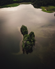 Drone footage of Island in a lake during sunset 