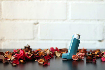 Medicine and health concept: Blue inhaler.