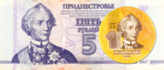 1 transnistrian ruble coin against 5 transnistrian ruble banknote indicating growing economics with copyspace