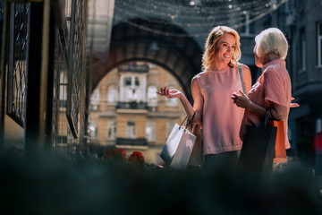 Joyful women laughing in the street stock photo