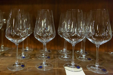 Handmade glass glasses are on the shelf of the store.