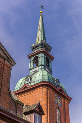 Fototapeta na wymiar Tower of the St. Nicholas church in Kappeln, Germany