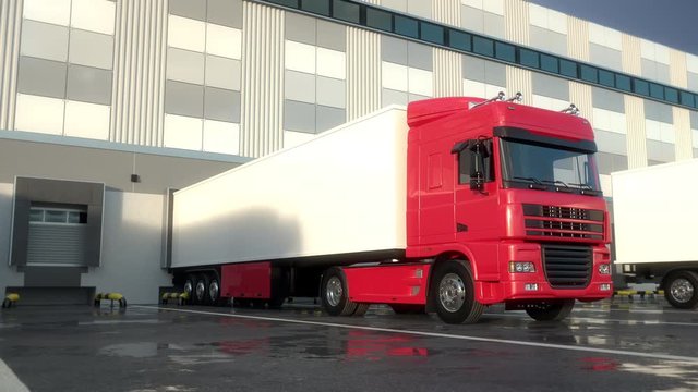 Red semi trucks docking onto warehouse dock to load or unload goods. Low parallel tracking shot. Seamless loop. Realistic high quality 3d animation.
