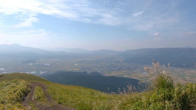 Green lanscape with mountain Aso background, view at the top of mountain from Daikanbō Mount Aso, Aso, Kumamoto, Kyushu, Japan