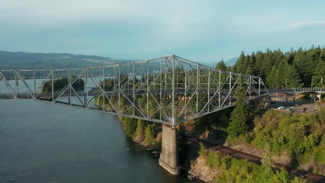 The Bridge of the Gods is a steel truss cantilever bridge that spans the Columbia River between Cascade Locks, Oregon, and Washington state near North Bonneville. 