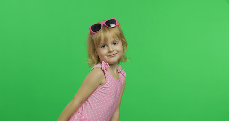 Happy, pretty child girl in pink swimsuit and sunglasses. Vacation. Chroma Key