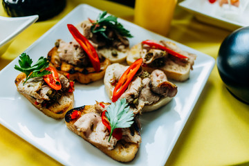 Appetizers  presented on a yellow-black background