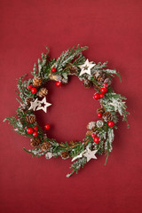 Fototapeta na wymiar Top view of traditional Christmas wreath with copy space. Winter holidays and Christmas celebration