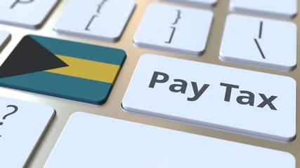 PAY TAX text and flag of Bahamas on the buttons on the computer keyboard. Taxation related conceptual 3D animation