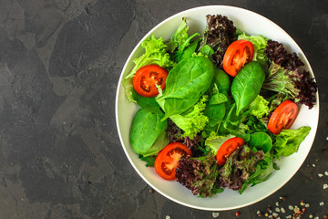 Healthy salad, leaves mix salad (mix micro greens, cucumber, tomato, onion, other ingredients)....