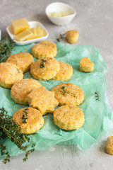 Freshly baked delicious english scones or cookies with cheese and thyme. Savory cheese scones or cookies.