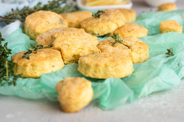 Freshly baked delicious english scones or cookies with cheese and thyme. Savory cheese scones or cookies.