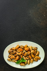mussels in oil (delicious seafood) portion serving. top food background. copy space