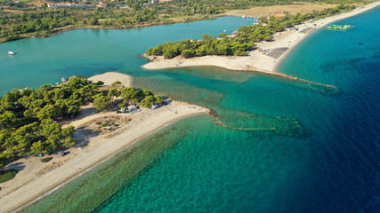 Aerial drone view of iconic sandy bay and turquoise beach of Galrokavos in Kassandra Peninsula,...