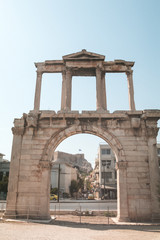 Fototapeta premium Arch of Hadrian or Hadrian's Gate monument with the Parthenon in the background, Athens, Greek