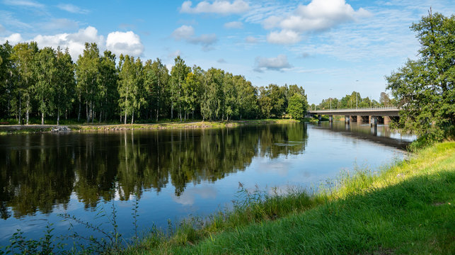 green nature in karlstad sweden, tree refection in the river sourrounded by green nature