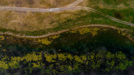 A road in a plain shot from above.