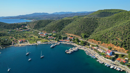 Fototapeta na wymiar Aerial drone photo of iconic paradise bay and sandy beach of Porto Koufo with turquoise calm sea protected by winds, South Sithonia Peninsula, North Greece