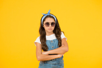 Little fashionista. Cute kid fashion girl. Summer fashion concept. UV protection. Girl long curly hair sunglasses tied head scarf. Fashion trend. You can have anything you want if dress for it