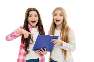 This stylish clip board keeps our documents handy. Happy little girls holding writing board. Small children smiling with blue plastic board. Clip board is a good solution for document management