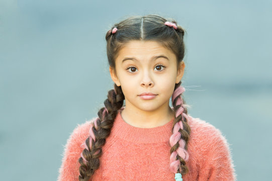 Girl With Braided Hair Style With Pink Kanekalon. Hairdresser Salon. Fancy Look. Braided Cutie. Little Girl With Cute Braids Close Up. Kanekalon Strand In Braids Of Child. Braided Hairstyle Concept