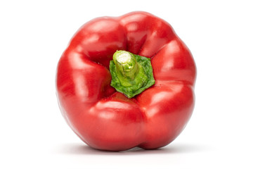One whole red bell pepper front view with green stem isolated on white background