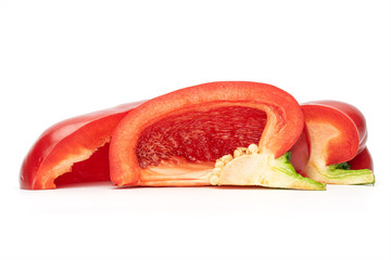 Group of three slices of red bell pepper isolated on white background