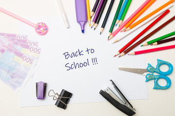 stationery, money on white paper white background place copy top view back to school