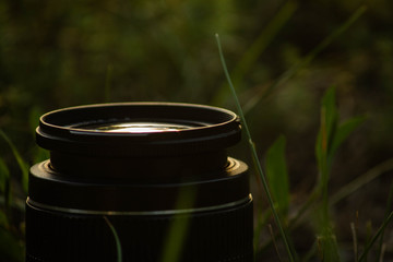 Camera equipment, glass lens, photography set, nature background	