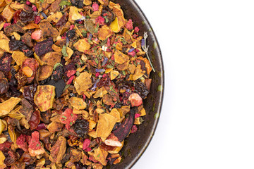 Closeup of lot of pieces of lavender strawberry ice tea on grey ceramic plate flatlay isolated on white background