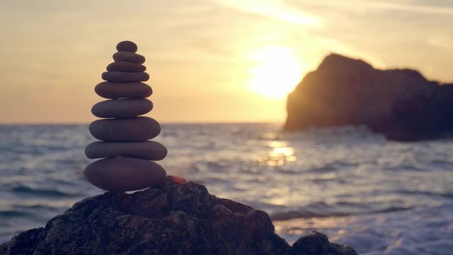 Concept of balance and harmony - stone stacks on the beach