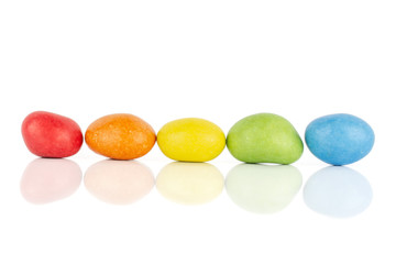 Group of five whole sugared nut dragee rainbow isolated on white background